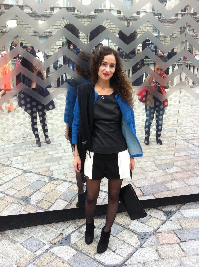 muymia at LFW SS14 Day3 wearing Soler leather top, Mireia Ruiz Rabbit fur jacket, Les Petites shorts, Topshop boots & Cos leather bag, necklace Tiffany's